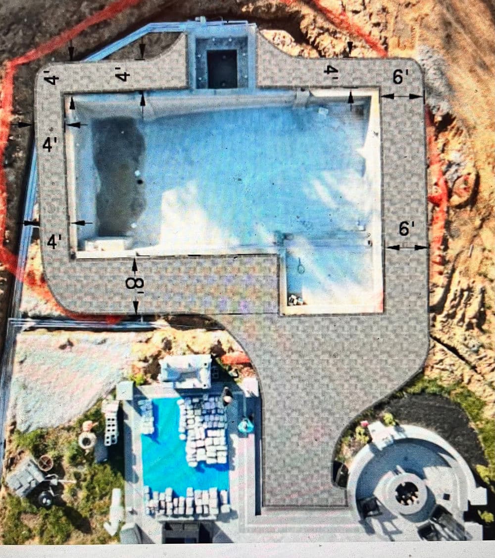 Aerial view of a property layout showing a pool and surrounding patio measurements.